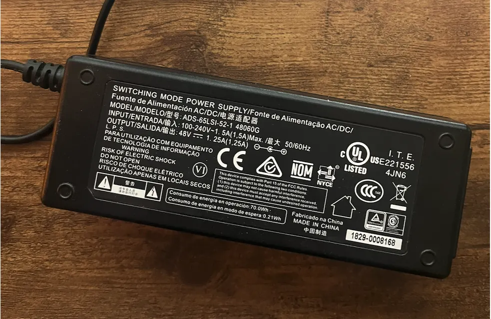 Example of a power adapter label: output 48 V 1.25 A, centre positive